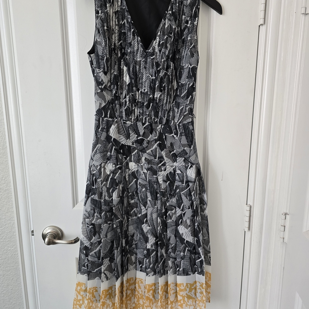 Elegant Black and White Patterned Dress with Gold Accents